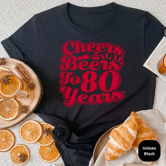 Cheers & Beers to 80 Years! Celebrate a Lifetime of Memories with Our Customizable 80th Birthday Shirt